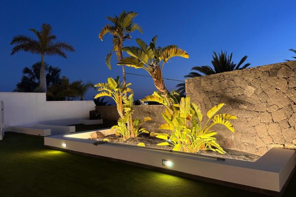 villa-dedalos-puerto-calero-poolside-gardens-by-night-01